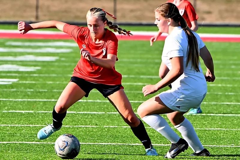 Brooklyn Wilson driving past a defender with the ball during a match